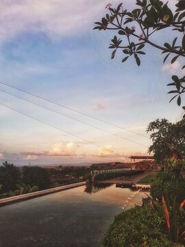 The beauty of sunset on a rooftop with a pool inside
