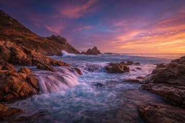 Fototapeta premium Coastal landscape captured during a breathtaking sunset, featuring rocky shore and dynamic waves