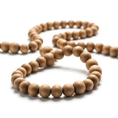 Obraz premium Close-up of natural light brown wooden beads, forming a calming spiritual string on white background