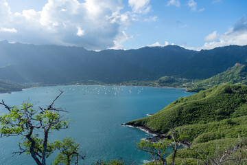 Taiohae Bay and town with anchored sailboats in Nuku Hiva, Marquesas Islands, French Polynesia