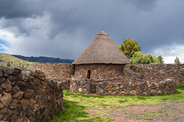 Traditional Thatched-Roof Hut at the Archaeological Site of Raqchi