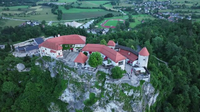 Bled, Slovenia - Aerial drone view of beautiful Bled Castle Blejski Grad with Lake Bled Blejsko Jezero, the Church of the Assumption of Maria and Julian Alps