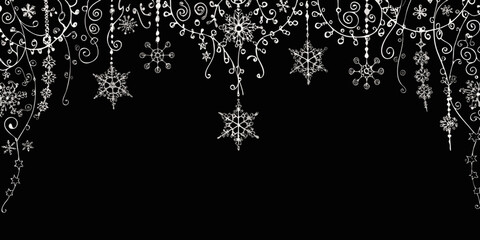 Delicate white snowflakes and ornaments on a black background create winter magic © Juel