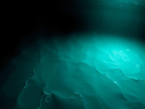 Ocean's emerald ribbon unfurls Calm, vast, waiting ,  tranquility,  aerial view