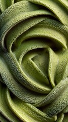 Close-Up of Matcha Green Tea Ice Cream Texture.Macro photography of swirled matcha green tea ice cream or soft serve with creamy texture, smooth spirals, and natural green leaf decoration.