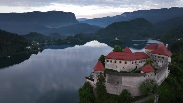 Bled, Slovenia - Aerial drone view of beautiful Bled Castle Blejski Grad with Lake Bled Blejsko Jezero, the Church of the Assumption of Maria and Julian Alps