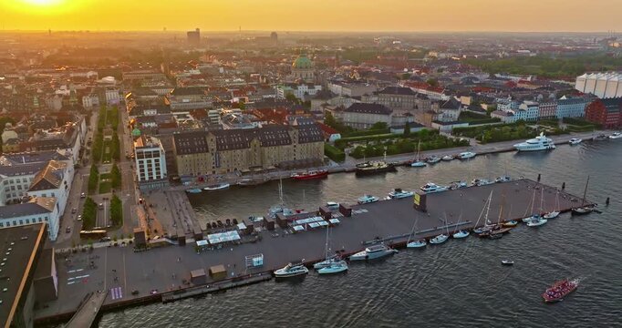 Aerial view of downtown Copenhagen in Denmark atsunset. A view of the embankment and the old part of the city with a church and other landmarks
