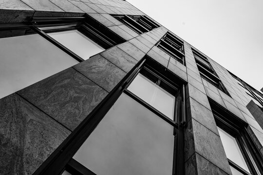 Modern stone facade and glass windows in minimalist black and white architecture