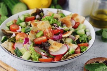 A bowl with Fattoush - Traditional Levantine salad