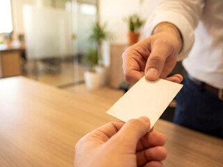Hand giving business card networking advertisement background professional contact identity corporate office meeting career partnership copy space template stationery