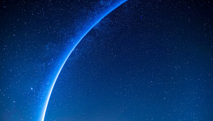 Futuristic abstract space background featuring a glowing blue planet horizon and starry night sky. Copy space. Ideal for technology, science, astronomy, banners, and digital backgrounds.