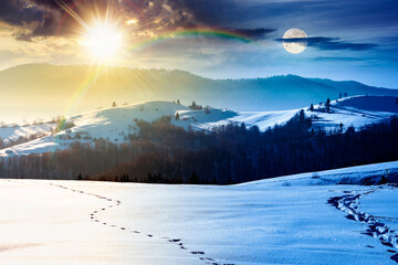 beautiful winter landscape with snow covered rolling hills. day and night time change concept. majestic mountains with sun and moon. frosty countryside scenery. harmony and progress calendar