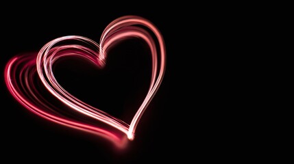 A vibrant, red heart floats against a stark black backdrop, its light trails softly glowing to express romance, love, and connection in an image of abstract beauty.