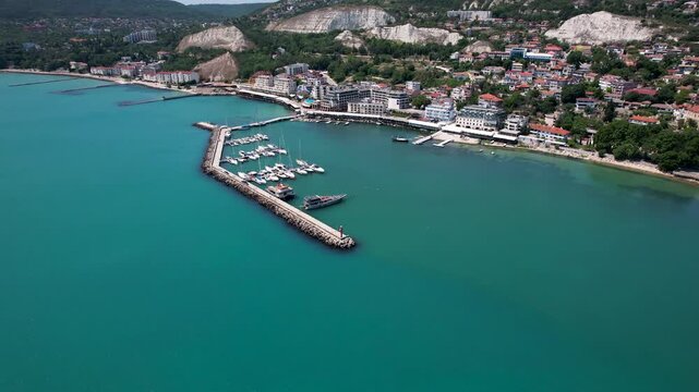 Aerial view of boats docked in the marina, contrasting against the turquoise water and the coastline of the city, Balchik, Dobrich Province, Bulgaria.