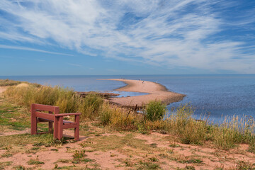 Park bench overlooking beach at North Cape, Prince Edward Island, Canada.