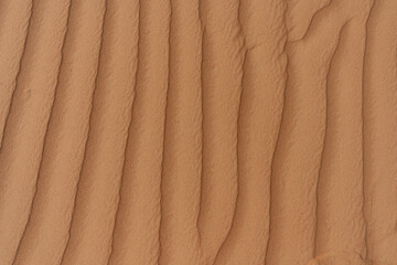 Symmetrical wind patterns in desert sand, Oman