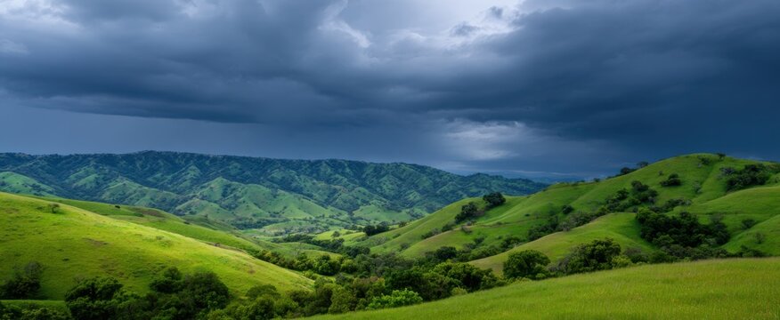distant thunder dances over green hills like nature&rsquo;s drumroll for an incoming storm