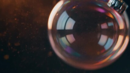 Macro view of a soap bubble with colorful reflections against a dark, sparkling background sphere - Powered by Adobe