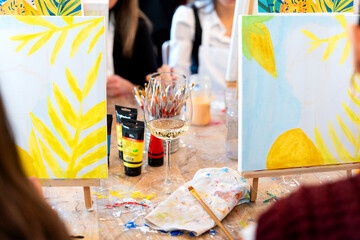 Fototapeta premium Women enjoying sip and paint art workshop