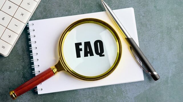 Animation the appearance of a conceptual phrase, a FAQ symbol on a blank sheet through a magnifying glass. Development concept, business, strategy, innovation, technology