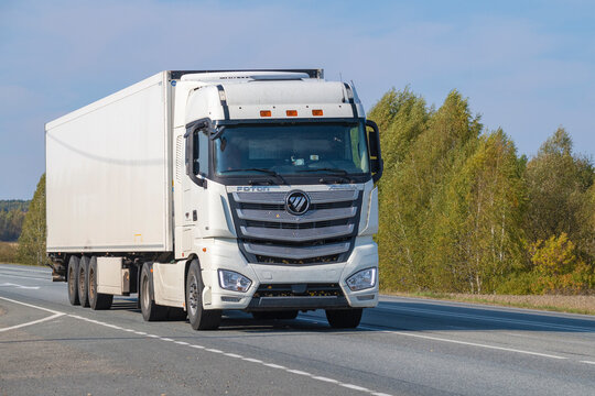 OMSK REGION, RUSSIA - SEPTEMBER 21, 2025: Chinese truck Foton Auman P 460 on the highway of the R-255 "Siberia" on a September day