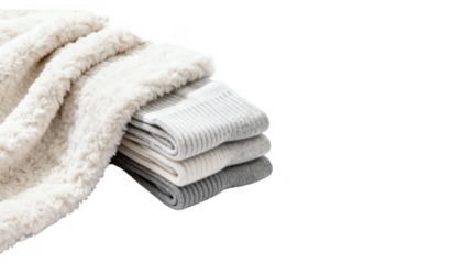 Folded textiles including a fluffy throw and thermal socks stacked on a clean white backdrop representing soothing warmth and chill comfort.