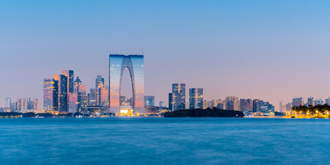 Night view of Jinji Lake and Gate to the Orient in Suzhou, Jiangsu Province, China