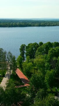 Volga river embankment greenery flourishing in spring sunshine. Clip