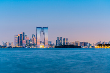 Night view of Jinji Lake and Gate to the Orient in Suzhou, Jiangsu Province, China