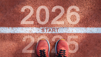 A top-down view of a runner's shoes at the "START" line, with 2025 behind and 2026 ahead.