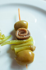 Gilda pintxo with olive, anchovy, and pickled pepper