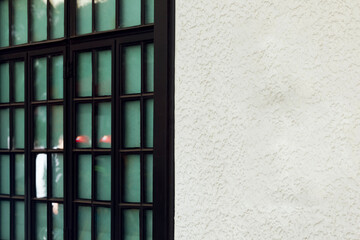 green window on a wall