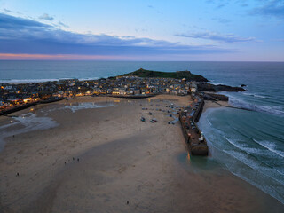 Vibrant twilight elevated capture of St Ives town, bay and beaches in Cornwall, UK