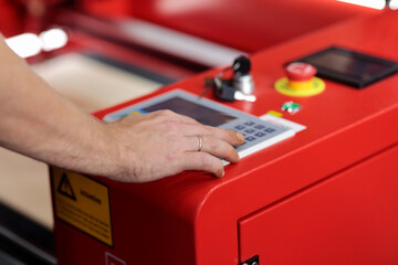 hand on the control panel