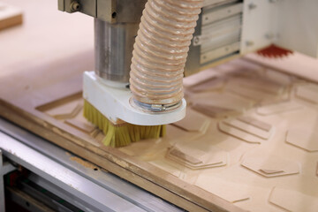 process of engraving MDF panel with a CNC router
