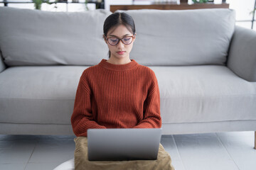 Asian woman digital nomad freelancer work typing laptop on online meeting Remote work.