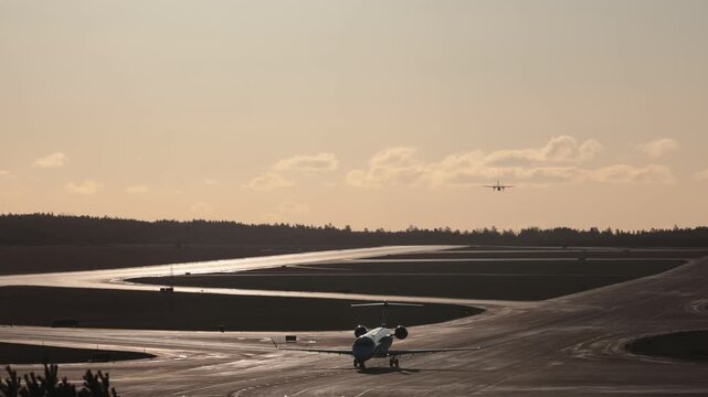 Stockholm Sweden A commercial airliner lands on the runway on a crisp sunny day at Arlanda Airport.