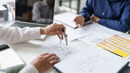 Architecture drawing on architectural project business architecture building construction Colleagues designer Planning Design on blueprint and compasses