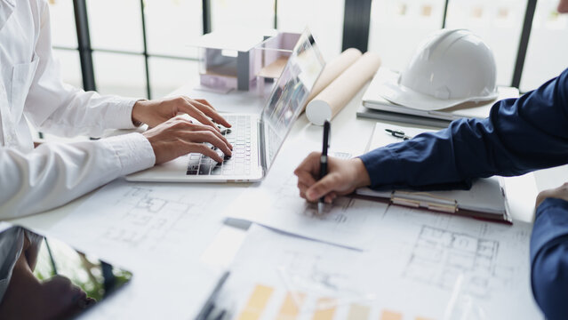 Architecture drawing on architectural project business architecture building construction Colleagues designer Planning Design on blueprint and compasses