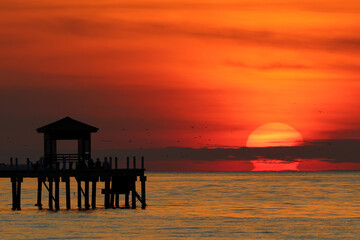 The silhouette of the pavilion with a beautiful sunrise in the morning.