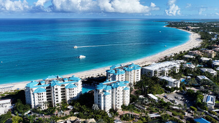 Fototapeta premium Grace Bay At Turks And Caicos In Overseas Territory United Kingdom. Stunning Cityscape. Beach Landscape. Highrise Buildings. Grace Bay In Turks And Caicos United Kingdom. Caribbean Background.