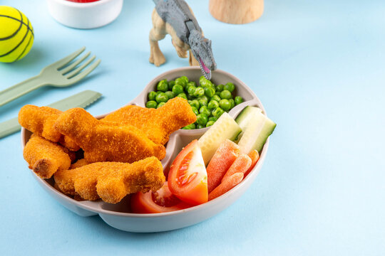 Tasty kids food, dinosaur shaped chicken nuggets