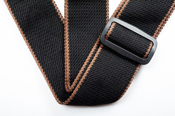 Black fabric strap for electric or acoustic guitar.