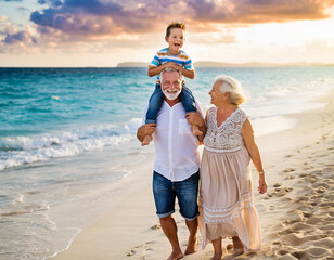 Dziadkowie spacerujący z wnukiem po plaży