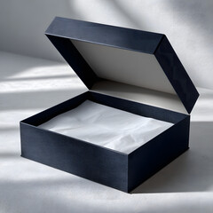 navy blue textured gift box open lid revealing white tissue paper inside, clean light background with shadow patterns, premium product
