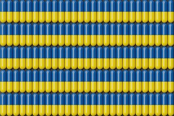 Obraz premium Yellow and blue pills on black surface. Top flat view