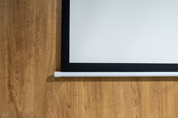 Fragment of Blank Projection Screen with Copy Space on Wooden Wall