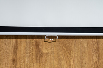 Fragment of Blank Projection Screen with Copy Space on Wooden Wall
