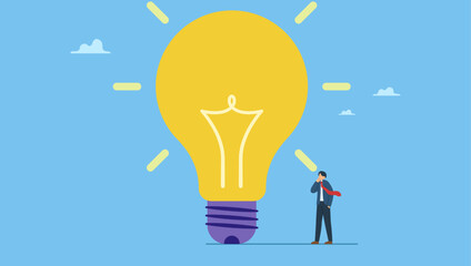 Smart businessman thinking with big oversized idea lightbulb. Think big, aspiration to win and success in business, big idea from creativity and imagination to overcome fear. © Saklarboy