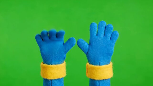 Playful Blue Hands Gesturing on Green Background
